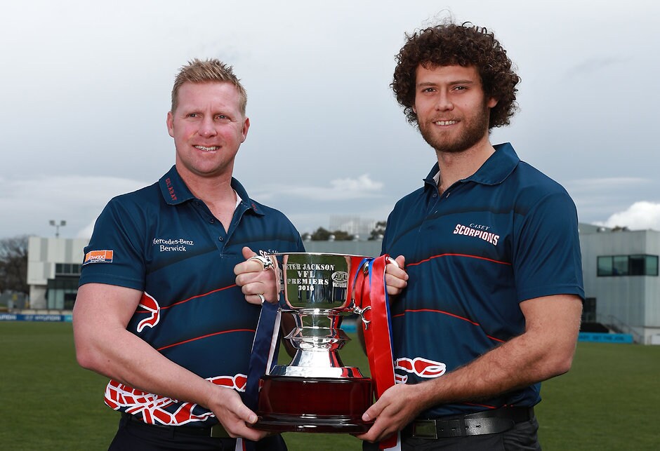 AFL 2016 Media - VFL and TAC Grand Final Press Conference MELBOURNE, AUSTRALIA - SEPTEMBER 21: Casey Scorpions coach Justin Plapp and captain Jack Hutchins pose with the VFL Premiership Cup during the VFL and TAC Cup Grand Final press conference at Ikon Park on September 21, 2016 in Melbourne, Australia. (Photo by Scott Barbour/AFL Media)